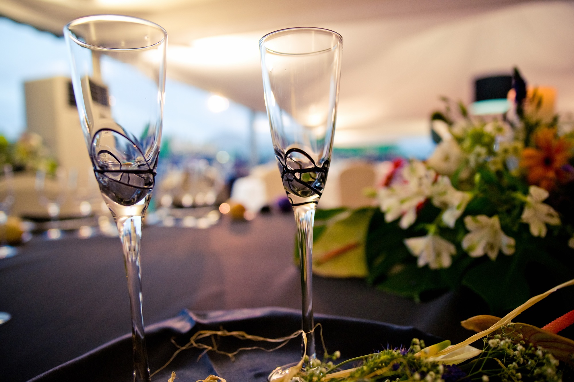 Pair of glasses prepared for the toast with champagne at an event.